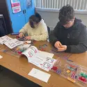 Students working on activities from Pop the Trunk