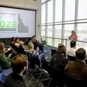 Student giving a live mini-talk at Connections Project