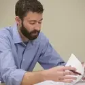 Faculty reviewing papers