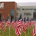 Flag display in front of the Nampa Campus Academic Building