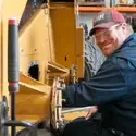 CWI Heavy Equipment student working on a skid steer