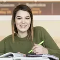 female student on campus studying