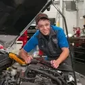 CWI Automotive Technology student working on a car in the lab