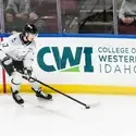 Hockey player on the ice with CWI logo