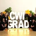 Employees standing in front of CWI Grad sign