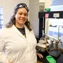 Rebecca Flock posing for a picture in front of lab