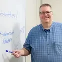 Gary Heller in front of whiteboard