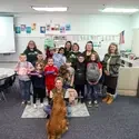 Central Elementary School students and staff holding up donated school supplies