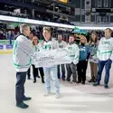 Alexander Lacy recieving his scholarship at Idaho Steelheads game