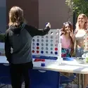 CWI students playing connect four outside