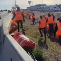 Law Enforcement students picking up trash along Interstate 84