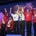 Carlos Gonzales (right) celebrates his silver medal on the podium.