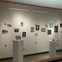 An image of a gallery wall featuring artwork by students from the College of Western Idaho.