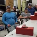 Plumbing Apprentices sitting at tables in a classroom