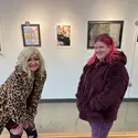 2022 Juried Art Exhibition winner, Christy Runion, right, alongside the model for her photography submission on display at the N