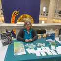 Sharol Viker at Idaho State Capitol at a CWI table