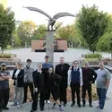 CWI Speech and Debate team posing in front of statue