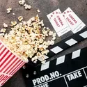 Popcorn, movie tickets, and film slate
