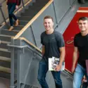 Students walking up stairs on campus