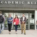 CWI students walking in front of the academic building