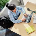Overhead view of student working on a laptop
