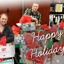 Staff putting together holiday care packages for students