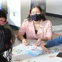 Students wearing masks playing Loteria