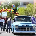 Graduate driving truck through cheering faculty and staff during Grad Fest 2021