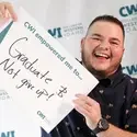 Graduate holding sign that reads, "CWI empowered me to graduate and not give up!"