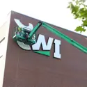 CWI’s new logo being installed on the outside of the Nampa Campus Academic Building