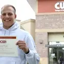 Dustin Rhodes, Exercise Science student with his civic scholarship award
