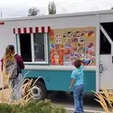 Students visiting an ice cream truck parked on campus