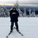 A CWI employee out on the ski slopes wearing a t-shirt with an undisclosed logo. 