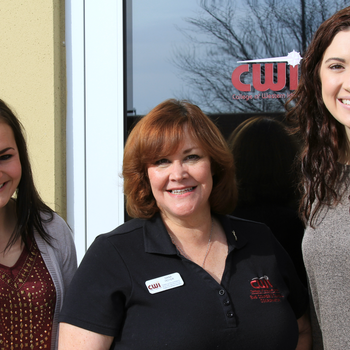 Dana Hoyer (center) and two EMS students/classmates.