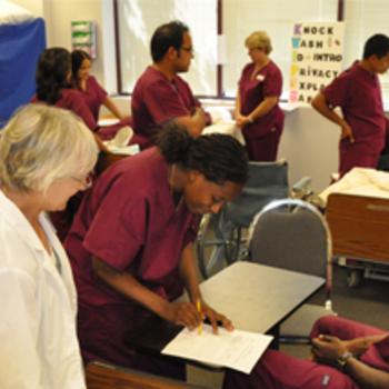 Multicultural healthcare students in classroom.