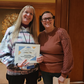 Linda Otto posing with her award