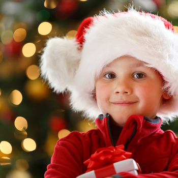 Child wearing a Santa ht