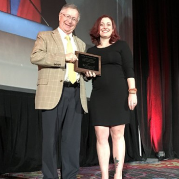 Rhonna Krouse accepting award at during the League for Innovation’s 2019 Conference in New York City.