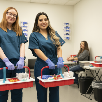 Health Sciences students with medical equipment tool box