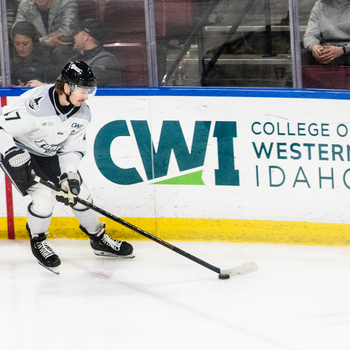 Hockey player on the ice with CWI logo