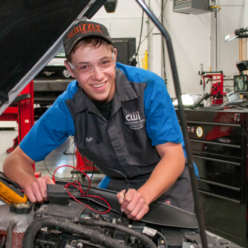 CWI Automotive Technology student working on a car in the lab