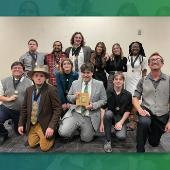 Speech and Debate team pose with award
