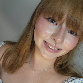 Headshot of Ria Eells