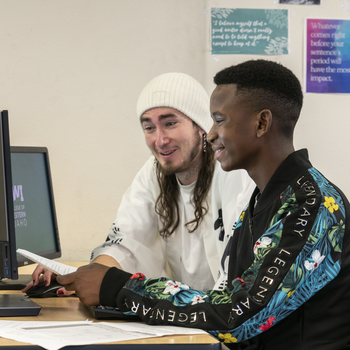 students working on computer