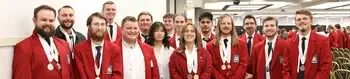 Group of students posing for a photo wearing SkillsUSA blazers with awards around their necks