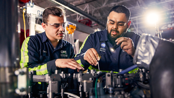 Student and instructor working on a heavy-duty truck in a campus lab