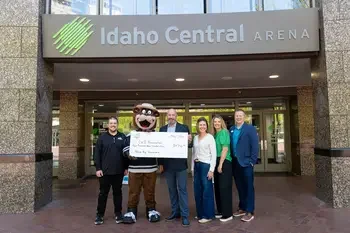 group of people hold Idaho Steelheads check