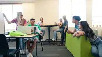 Students hanging out together in Learning Commons space on campus