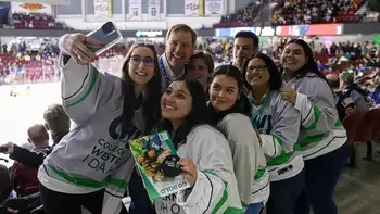 Group of students posing for a selfie at CWI Night at the Idaho Steelheads wearing CWI hockey jerseys