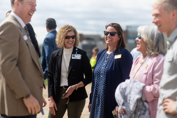 Members of the community talking with President Jones